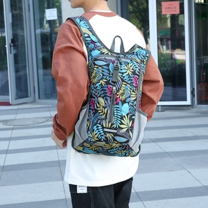 Waterproof folding cycling backpack with tropical floral print on lightweight nylon fabric