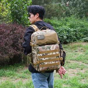 Tactical camouflage backpack for hiking with American flag patch and Molle system
