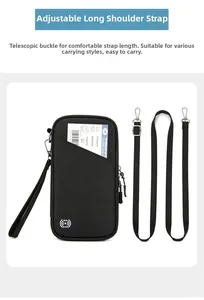 Close-up of black RFID blocking passport bag with adjustable strap and wristlet