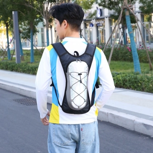 Outdoor hydration backpack for cycling and hiking with reflective grey fabric and elastic cords