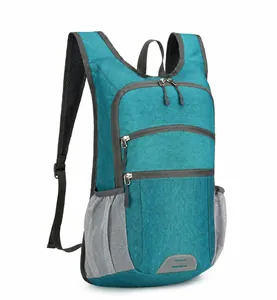 Detail view of the multi-layer storage and water-resistant fabric on the cyan hiking backpack
