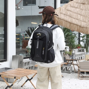 Black and grey 40L outdoor hiking backpack with ergonomic straps shown in use