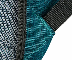 Close-up of reinforced stitching and breathable honeycomb mesh on the blue hiking backpack