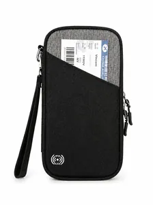 Detail showing the front of RFID blocking passport holder with durable fabric and wrist strap