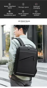 Detail of black business backpack featuring integrated external USB charging and headphone port