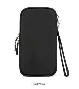Rear view of black nylon multi-layer passport bag with dual zippers and wrist lanyard