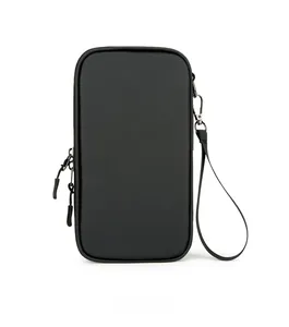 Detail of travel passport bag showing durable black nylon texture and dual zipper closure