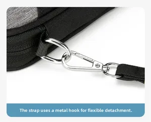 Detail showing removable hand strap with metallic spring hook on multifunctional passport bag