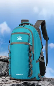 Macro shot of 55L blue hiking backpack details including side mesh pockets and webbing straps