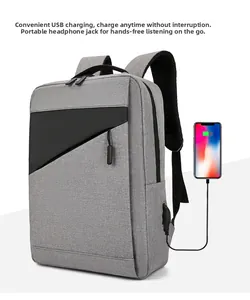 Detail of grey laptop backpack showing external USB charging port and headphone jack connection