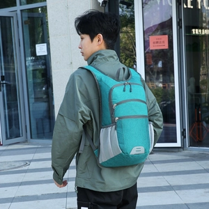 Water-resistant large capacity teal outdoor hiking backpack with safety reflective strip