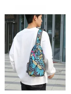 Men's crossbody bag with colorful tropical leaf pattern showing side mesh pocket and earphone port