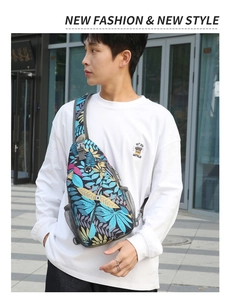 Detail view of the tropical leaf print chest bag with adjustable strap and mesh pocket