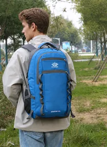Close-up of a blue 55L hiking backpack with breathable mesh straps and side pockets