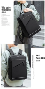 Detail view of black waterproof business backpack with reflective strip and zipper pocket