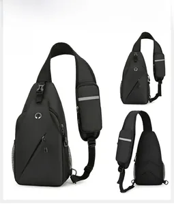 Detail view of black chest bag showing headphone port, reflective strap and breathable mesh