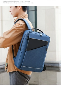 Blue business laptop backpack featuring a safety reflective strip and textured fabric