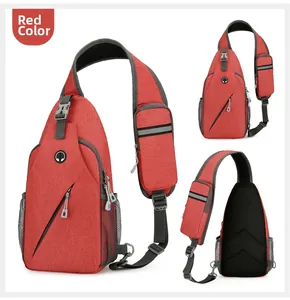 Detail view of red versatile sling bag with headphone port, mesh pocket and padded strap