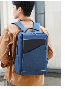 Close-up of British style laptop backpack featuring navy blue fabric and geometric stitching