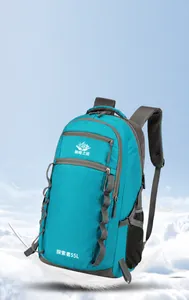 Detail view of lightweight 55L blue hiking backpack with breathable mesh shoulder straps