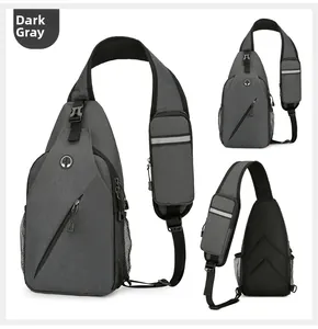 Detail view of dark grey crossbody bag with headphone port and reflective strap