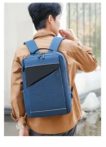 Blue business laptop backpack with built-in USB charging port and breathable shoulder straps