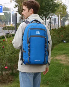 Blue outdoor hiking backpack with 55L capacity and side straps shown on a male model
