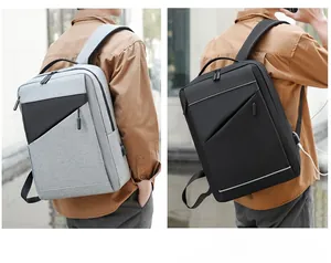 Detail of waterproof business backpack showing external USB port and ergonomic strap design
