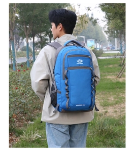 Detailed view of blue 55L outdoor hiking backpack with Vanaheimr logo and durable chest straps