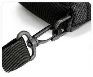 Macro shot of durable swivel hook and high-density mesh fabric on a black chest bag