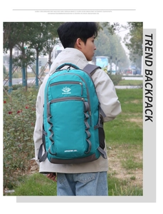 Detail of 55L blue hiking backpack with ergonomic back support and adjustable straps