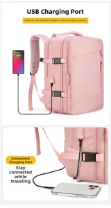 Detailed view of pink travel backpack featuring an external USB charging port and side buckle