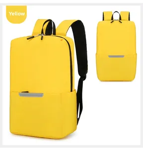 Detail view of yellow backpack featuring safety reflective strips and durable fabric texture