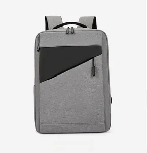 Front view of grey business laptop backpack featuring a USB port and sleek zipper pocket