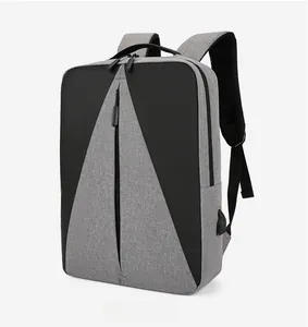 Vue latérale d'un sac à dos d'affaires bicolore avec port USB et textile gris chiné