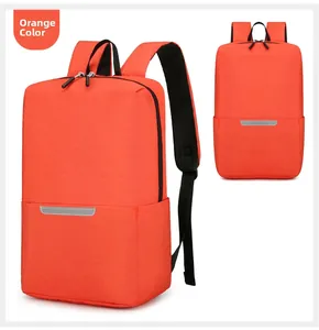 Detail view of orange backpack featuring reflective safety strip and durable fabric