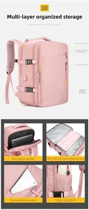 Pink travel backpack showing organized compartments for laptop, wet/dry items, and USB port