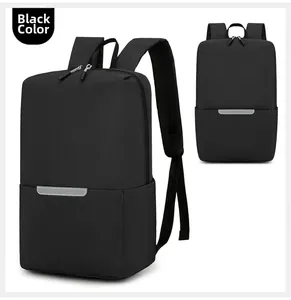 Close-up of minimalist black backpack featuring safety reflective strip and waterproof fabric