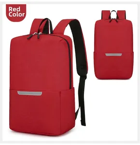 Macro detail of red lightweight backpack featuring reflective safety strip and fabric texture