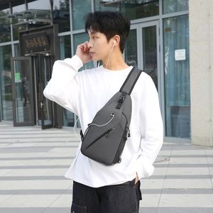 Minimalist grey water-resistant chest bag for men with adjustable strap and side mesh pocket