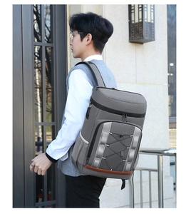 Outdoor insulated picnic backpack in grey featuring multi-layer storage and elastic cords