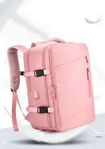 Pink travel backpack showing side adjustable buckle and USB charging port detail