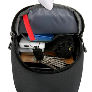 Versatile dark grey crossbody sling bag with organized interior pockets and key clip