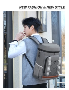 Close-up of gray outdoor camping backpack with elastic cord and leather detail on back