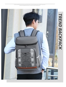 Outdoor picnic backpack detail with criss-cross elastic cords and reflective safety strips