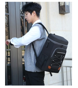 Detail of insulated outdoor backpack with black wear-resistant fabric and side mesh pocket