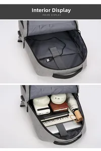 Vue intérieure du sac à dos avec plusieurs compartiments et câble USB intégré