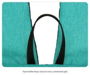 Detail of blue ultra-light backpack featuring black top webbing handle for easy carrying