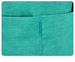 Detail of teal nylon fabric showing reinforced stitching and premium sewing craftsmanship