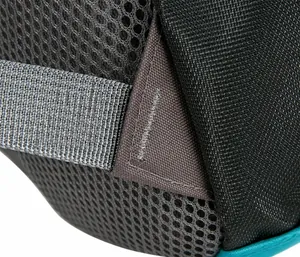 Detail of reinforced stitching on grey breathable mesh and black nylon outdoor backpack